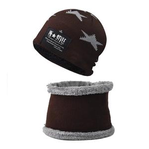 Detail of warm winter knit hat and scarf set with thick gray fleece lining and star pattern
