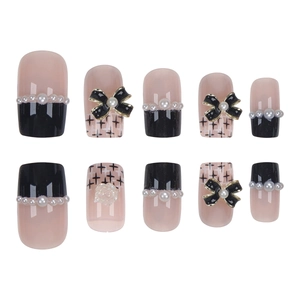 Short black and pink press-on nails set with 3D bows and pearl accents