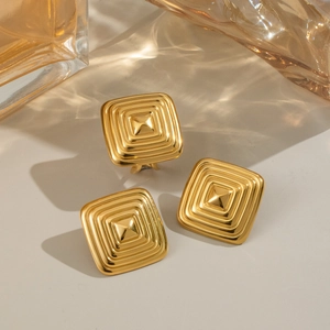 Chic gold square jewelry set including textured geometric earrings and matching ring