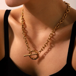 Detail of 18K gold stainless steel chunky chain necklace featuring a textured OT toggle clasp