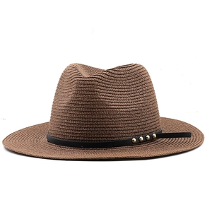 Classic dark brown wide brim straw Panama hat with black leather band and gold studs