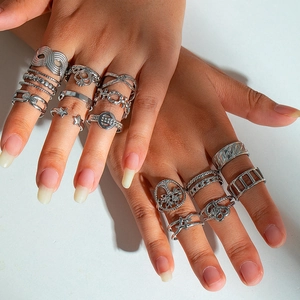 Detailed view of silver alloy rings set featuring star and tree of life designs