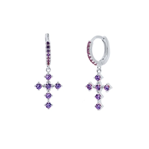 Macro detail of silver cross earrings with vibrant purple cubic zirconia stones