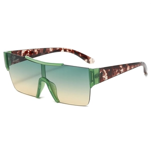 Fashionable rimless oversized shield sunglasses with green-yellow gradient lenses
