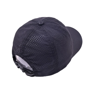 Detail view of adjustable strap and breathable laser-cut mesh on the black baseball cap
