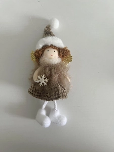 Detail of Christmas angel doll with golden wings, brown knit dress and white plush hat