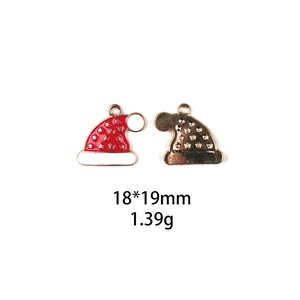Detailed view of red and gold Christmas hat alloy charms showing size 18x19mm and weight