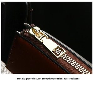 Close-up of golden metal zipper on brown leather bag with smooth opening and closing