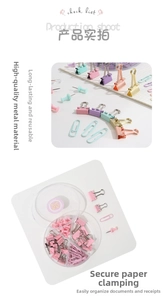 Macro shot of macaron-colored paper clips and binder clips in a 4-grid organizer box