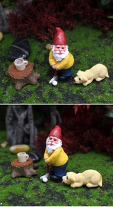 Macro detail of gnome golfer and golden retriever puppy resin garden figurines
