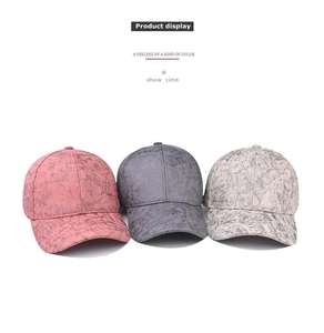 Detailed view of three baseball caps featuring unique marble texture in pink, grey and white