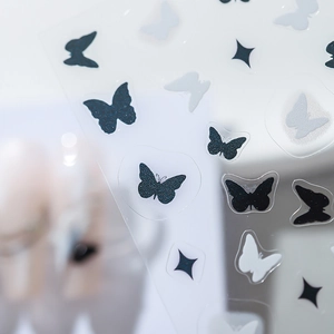 Minimalist butterfly and star nail art stickers with elegant matte and glitter finish