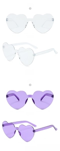 Close-up of heart-shaped rimless sunglasses in transparent and purple candy colors