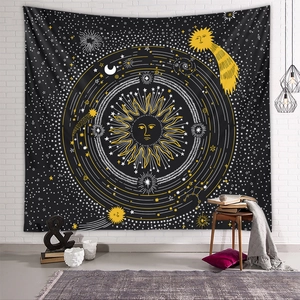 Detailed close-up of a sun and moon wall tapestry in a cozy living room setting