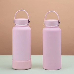 Pink 1L insulated sports water bottle with matte finish and portable wide carry handle