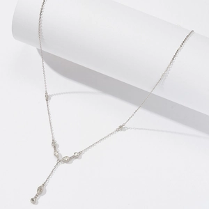Detail of S925 sterling silver Y-shaped lariat necklace with teardrop zircon pendants