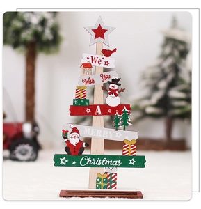 Detailed close-up of a wooden Christmas tree ornament with Santa and Snowman figures