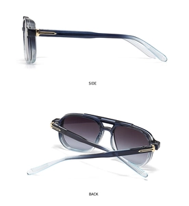 Detail view of vintage oversized sunglasses with blue frames and gold temple accents
