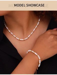 Model wearing a bohemian shell beaded necklace and bracelet set in white and lavender