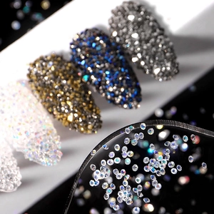Sparkling iridescent micro nail art crystals in various colors and jars for nail decoration