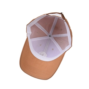 Internal view of brown cotton twill baseball cap with six-panel structure and metal buckle