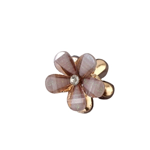 Cute resin flower hair claw clip with purple petals, green glitter and center rhinestone
