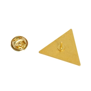 Macro detail of triangle pin back with golden brushed texture and butterfly clasp lock