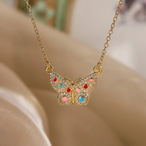 Detailed butterfly pendant necklace with colorful enamel and sparkling white crystals