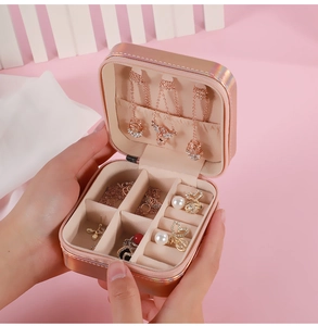 Handheld rose gold PU jewelry travel case with multiple compartments and beige lining