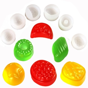 Silicone molds with resin pendants in fruit shapes like pineapple and strawberry