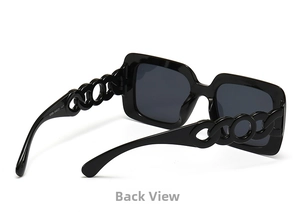 Detail view of square oversized sunglasses featuring unique hollow chain design temples