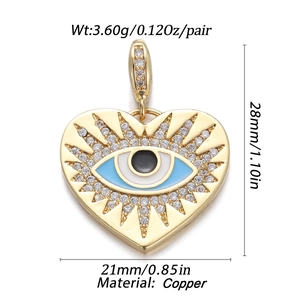 Macro view of heart-shaped evil eye pendant in copper with zirconia and enamel details