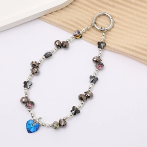 Detail view of crystal beaded keychain with silver beads and blue heart pendant charm