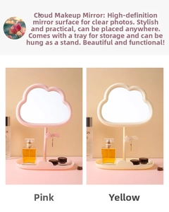 Detailed view of pink and yellow cloud-shaped makeup mirrors with storage trays and star hooks