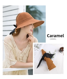 Detail of caramel summer sun hat featuring a silk bow and foldable roll-up design