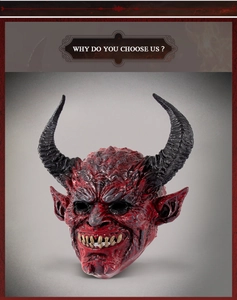 Detailed close-up of red demon mask showing skin texture, sharp black horns and fangs