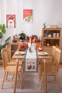 Modern Christmas table runner with Merry & Bright print on black and white plaid fabric