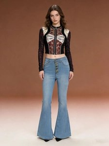 Close-up of five-button high-waisted flared jeans and a lace-patterned patchwork crop top