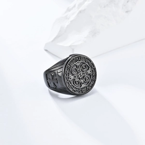 Macro shot of St. Benedict medal ring featuring matte black relief and cross detail