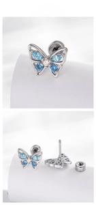 Detail of blue zircon butterfly cartilage stud with secure screw-back closure