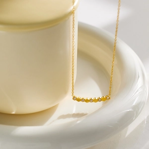Minimalist 18K gold titanium steel honeycomb necklace with crystals on a ceramic base