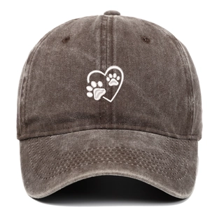 Detail of white heart dog paw embroidery on washed cotton charcoal baseball cap