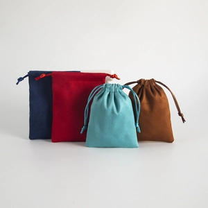 Flannel drawstring pouches for jewelry in deep blue, red, light blue, and brown