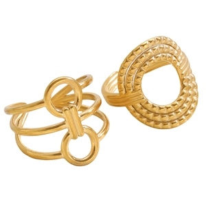 Detailed view of two gold chunky geometric rings featuring retro textured patterns