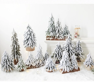 Mini PE snow-flocked Christmas trees with wooden bases for festive tabletop decor
