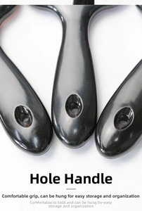 Close-up of black plastic comb handle with hanging hole for easy storage and use