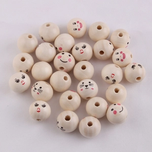 Macro shot of 20mm natural wood beads with smiley faces and animal patterns for jewelry DIY