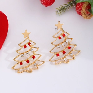 Detailed close-up of golden Christmas tree earrings with red rhinestones and star top