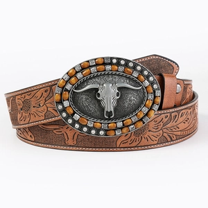 Brown leather western cowboy belt with embossed steer skull buckle and rhinestone details