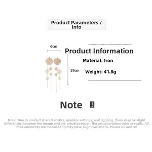 Detailed view of long gold metallic mesh earrings showing 29cm length and 6cm width